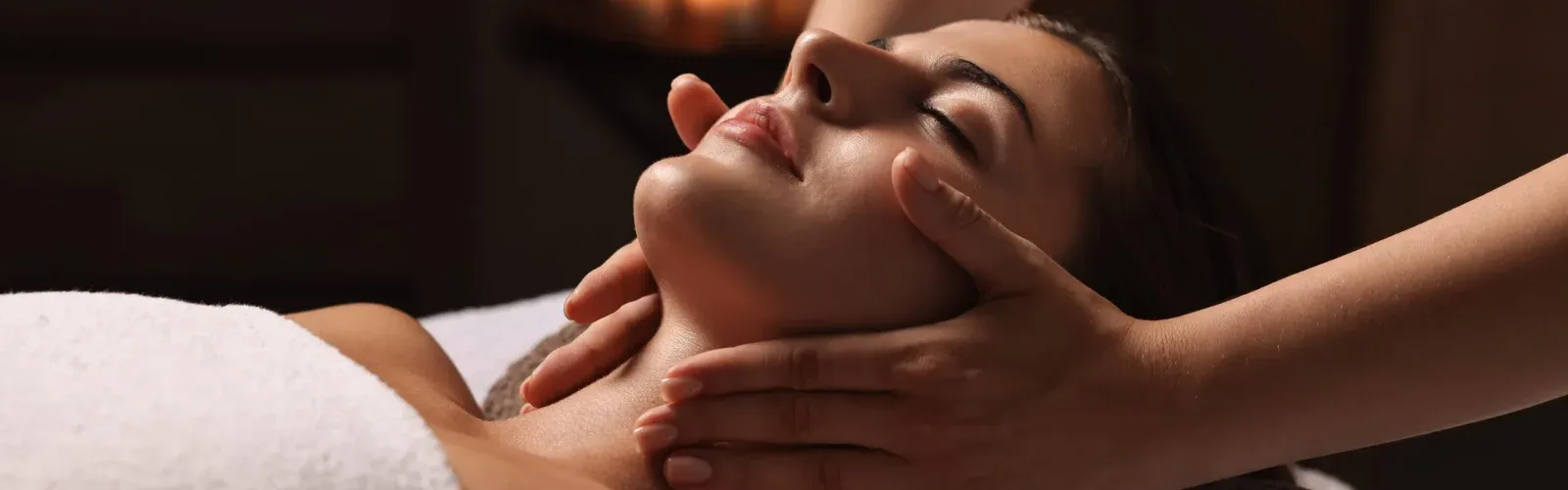 A guest receiving the targeted bio-active dermal protocol of Cellular Vitality at Agaporia's regenerative sanctuary in Montefollonico, Tuscany.