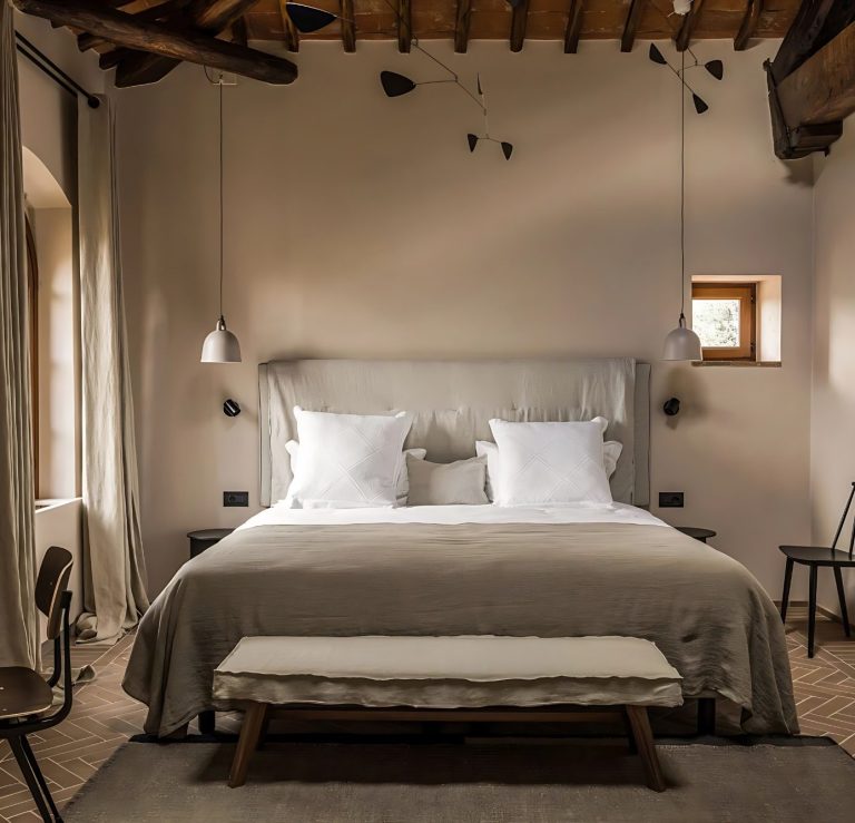 Elegant bedroom with a King Size bed. Antique details, such as wood-beamed ceilings, stone walls and hand-plastered finishes.