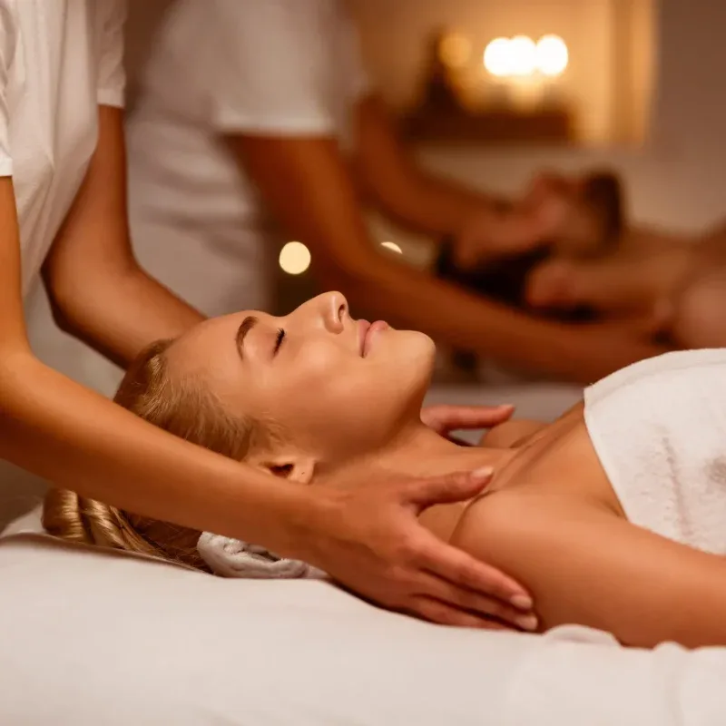 Two guests receiving the side-by-side ritual of The Shared Sanctuary within Agaporia's dual-protocol sanctuaries in Montefollonico, Tuscany.