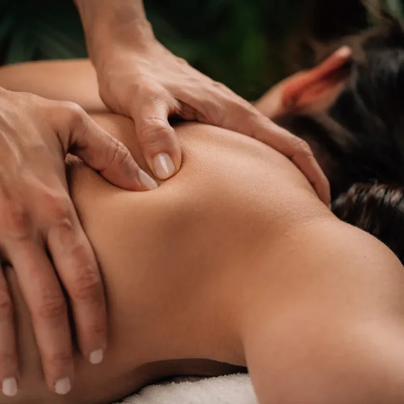 A guest receiving the deep somatic intervention of Structural Release at Agaporia's regenerative sanctuary in Montefollonico, Tuscany.