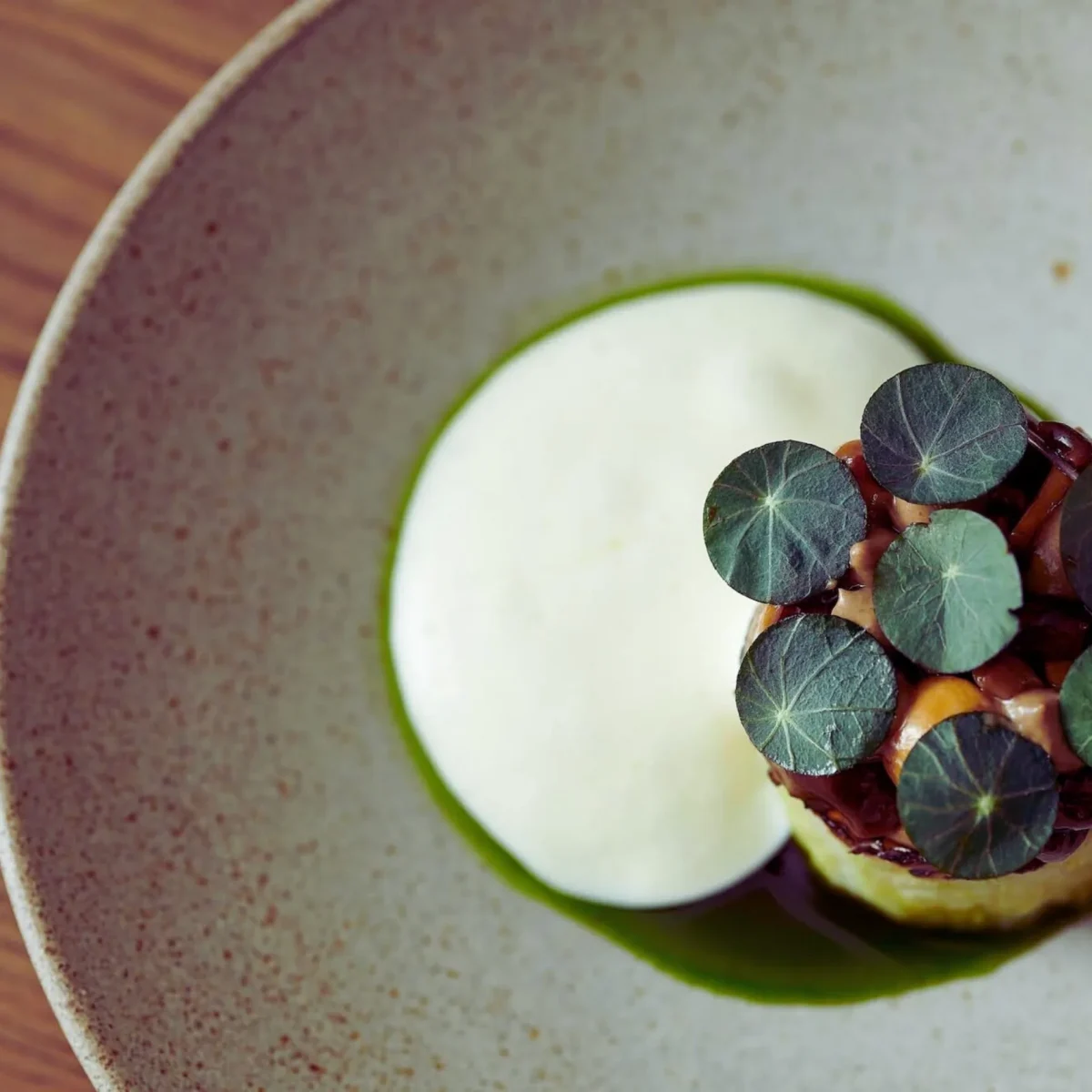 A dish from The Regenerative Table at the 70-hectare Agaporia estate, the regenerative five-star sanctuary in Tuscany. Flavour Is Evidence — soil health rendered through gastronomic precision.
